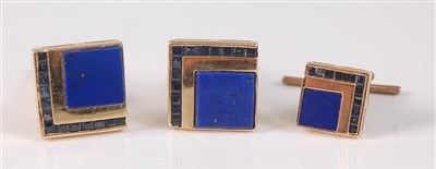 Lot 2126 - A yellow metal, lapis and sapphire cufflink...
