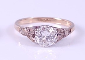 Lot 2157 - A yellow and white metal single stone diamond...