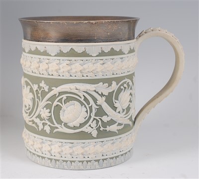 Lot 2045 - A Wedgwood green jasper ware tankard, having a...