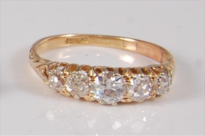 Lot 2206 - A Victorian yellow metal diamond half hoop...