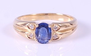 Lot 2156 - A yellow metal, sapphire and diamond dress...