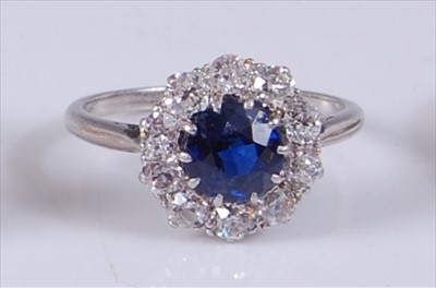 Lot 2200 - A white metal, sapphire and diamond circular...