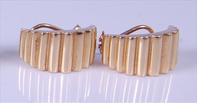 Lot 1203 - A pair of Tiffany & Co yellow metal corrugated...