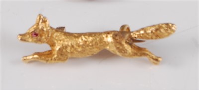 Lot 2214 - A yellow metal running fox brooch, with clip...