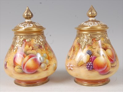 Lot 2042 - A pair of Royal Worcester porcelain pot pourri...