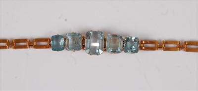 Lot 2159 - A yellow metal aquamarine bracelet, featuring...