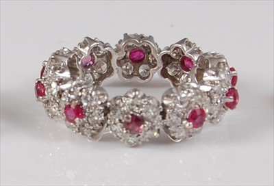 Lot 2184 - A white metal, ruby and diamond circular...