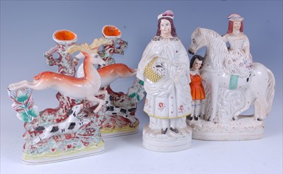 Lot 2055 - A pair of Victorian Staffordshire spill vases,...
