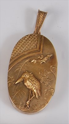 Lot 2164 - A Japanese Meiji period yellow metal oval...