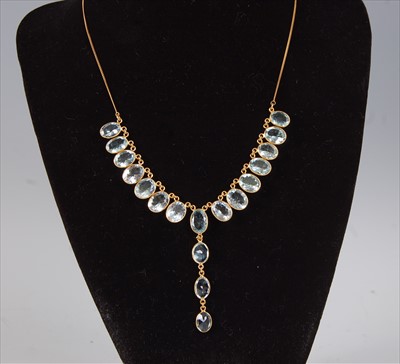 Lot 2195 - A contemporary yellow metal and aquamarine...