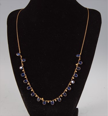 Lot 2221 - A contemporary yellow metal, sapphire and...