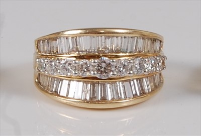 Lot 2283 - A contemporary 14ct gold diamond dress ring,...