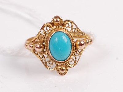 Lot 349 - A yellow metal turquoise set dress ring, the...