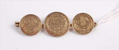 Lot 351 - A bar brooch containing three Turkish silver...