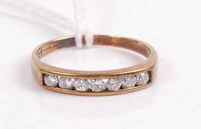 Lot 340 - A 9ct gold diamond half eternity ring, the...