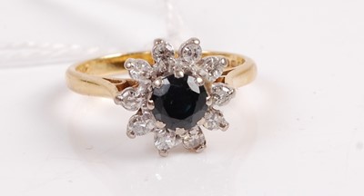 Lot 348 - A modern 18ct gold, sapphire and diamond set...