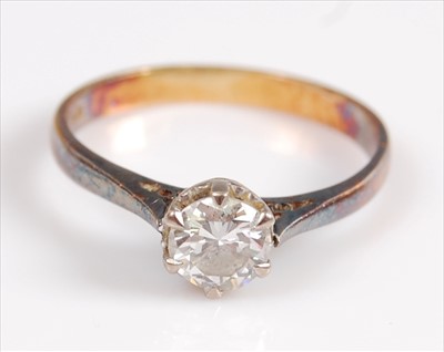 Lot 2036 - A yellow and white metal single stone diamond...