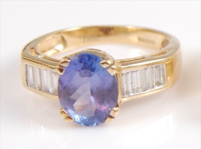 Lot 2065 - An 18ct yellow gold, tanzanite and diamond...