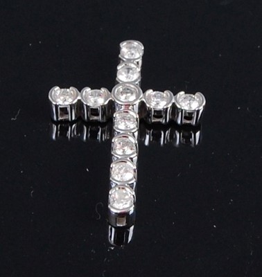 Lot 2072 - A 14ct white gold diamond set cross pendant,...