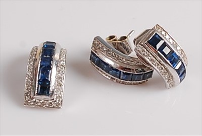 Lot 2105 - A white metal, sapphire and diamond pendant...