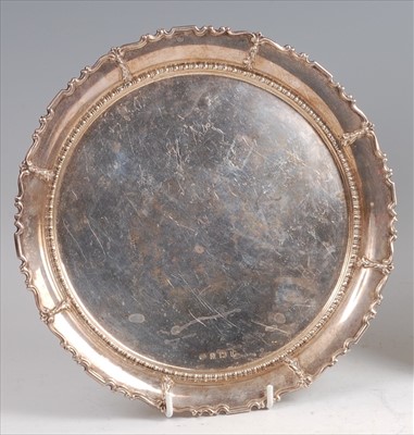 Lot 147 - A 1930s heavy silver salver, of circular form,...