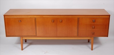 Lot 363 - A 1960s English teak long sideboard, having...