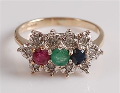 Lot 2133 - A 9ct yellow and white gold, ruby, emerald,...