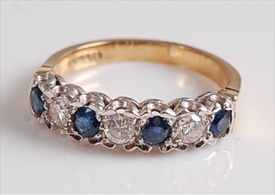 Lot 2141 - An 18ct yellow and white gold, sapphire and...
