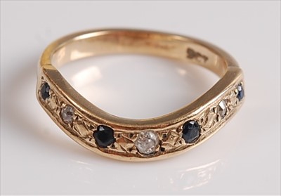 Lot 2136 - A yellow metal, sapphire and diamond wishbone...