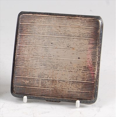 Lot 122 - An Art Deco silver engine turned pocket...