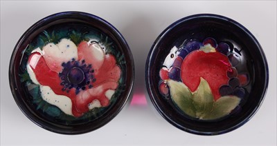 Lot 18 - A near-pair of Moorcroft pottery circular...