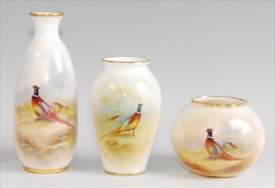 Lot 1077 - A Royal Worcester porcelain bottle vase, shape...