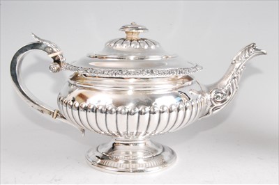 Lot 1139 - A George IV silver pedestal teapot, having...