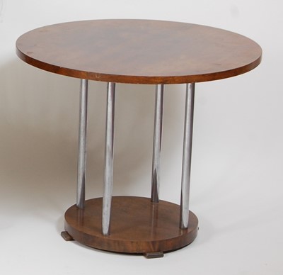 Lot 1233 - An Art Deco figured walnut circular two-tier...