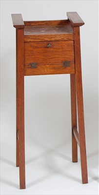 Lot 332 - An Arts & Crafts oak and rouge variegated...