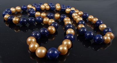 Lot 2149 - An opera length pearl and lapis lazuli...