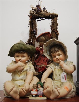 Lot 10 - A bisque porcelain musical automata doll,...