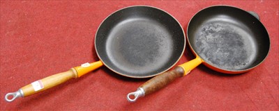 Lot 73 - A Le Creuset orange enamelled frying pan;...