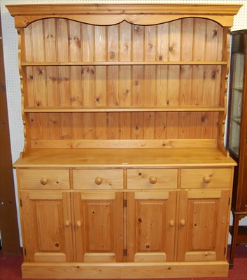 Lot 1122 - A modern pine round cornered Welsh dresser,...