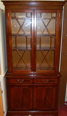 Lot 1123 - A reproduction mahogany bookcase cupboard,...