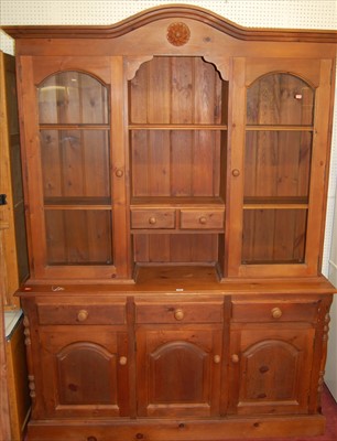 Lot 1125 - A modern stained pine dresser, having twin...