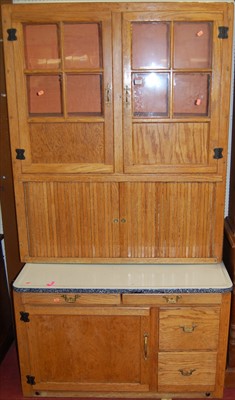 Lot 1126 - A 1930s oak kitchen cabinet, having twin...