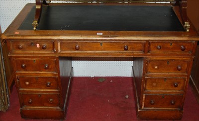 Lot 1127 - A Victorian oak round cornered twin pedestal...