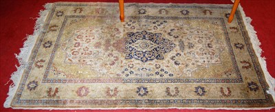 Lot 1141 - A Persian woollen pale ground rug, 180 x 114cm