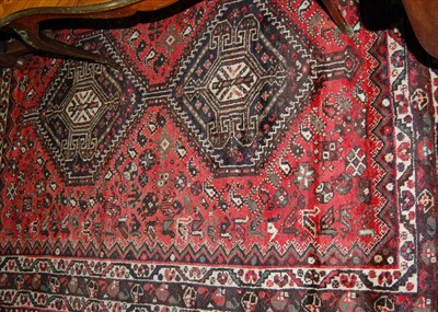Lot 1146 - A Persian woollen red ground Tabriz rug,...