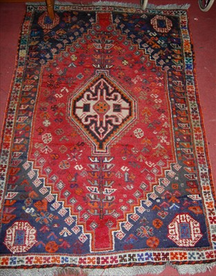 Lot 1147 - A Persian woollen red ground Tabriz rug, 165 x...