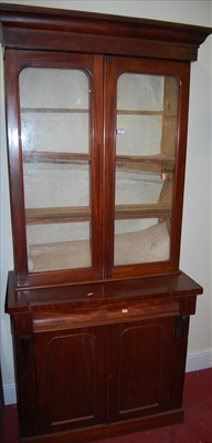 Lot 1153 - A Victorian mahogany bookcase cupboard, having...
