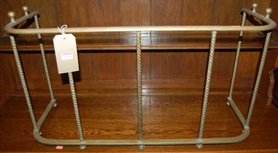 Lot 1154 - A circa 1900 brass low round cornered nursery...