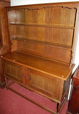 Lot 1155 - An early 20th century oak dresser, the...