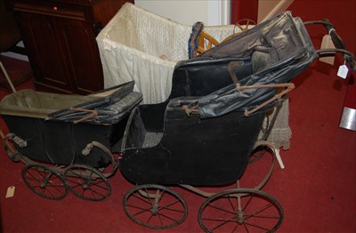 Lot 1159 - Two Victorian iron and canvas dolls prams;...